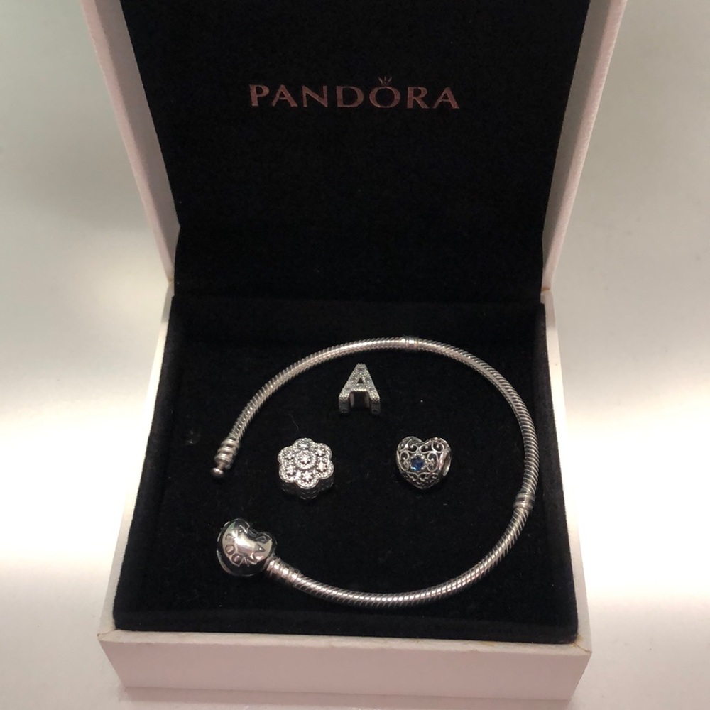 Pandora Bracelet with 3 Charms average size 7.5 - 19 cm in length.
